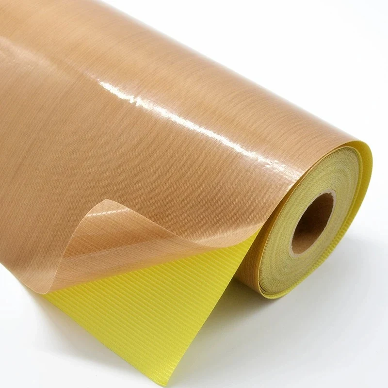 Brown PTFE fabric tape peeled away from a yellow release liner