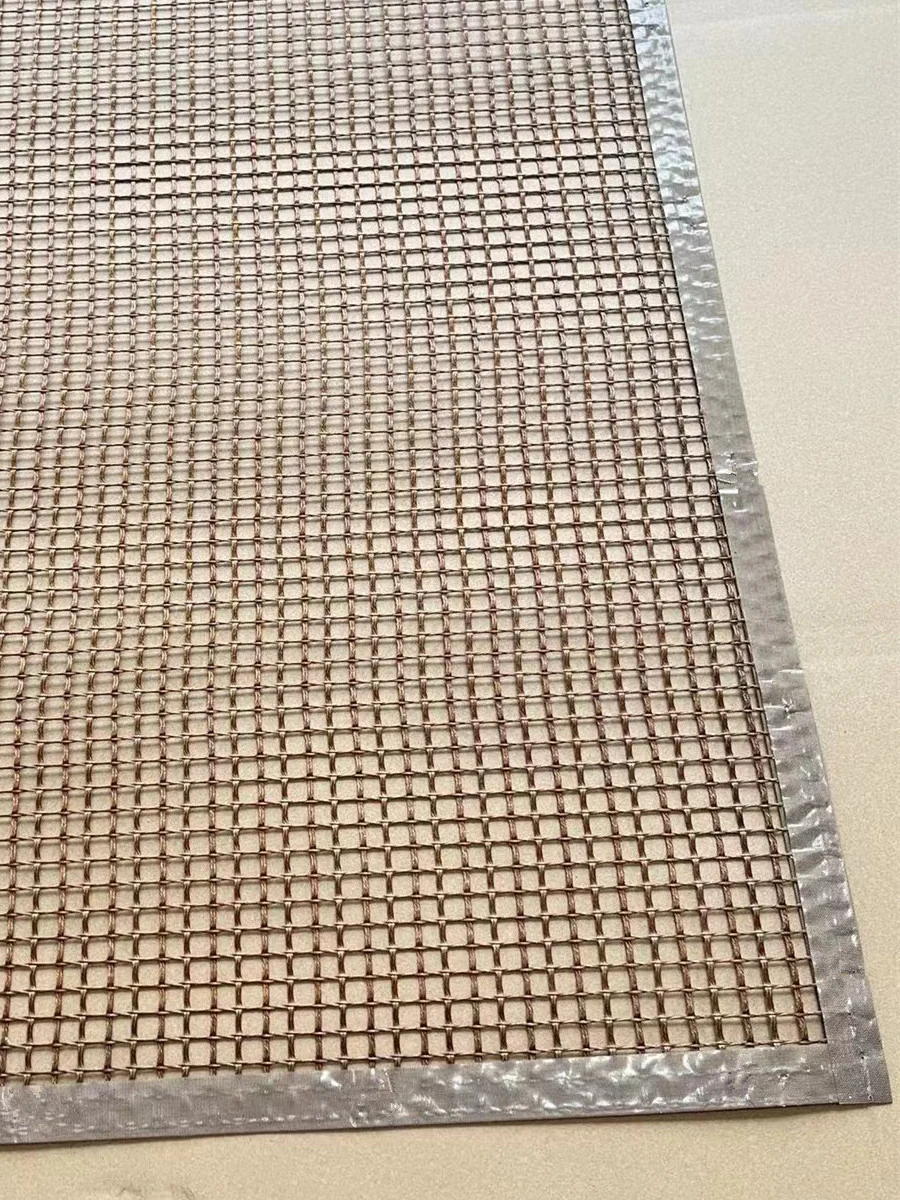 Stacked rectangular brown mesh mats with finished borders