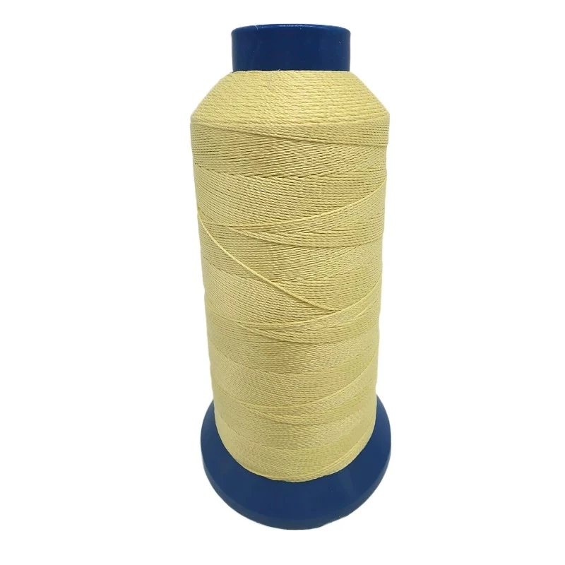 Yellow repair sewing thread on a blue spool